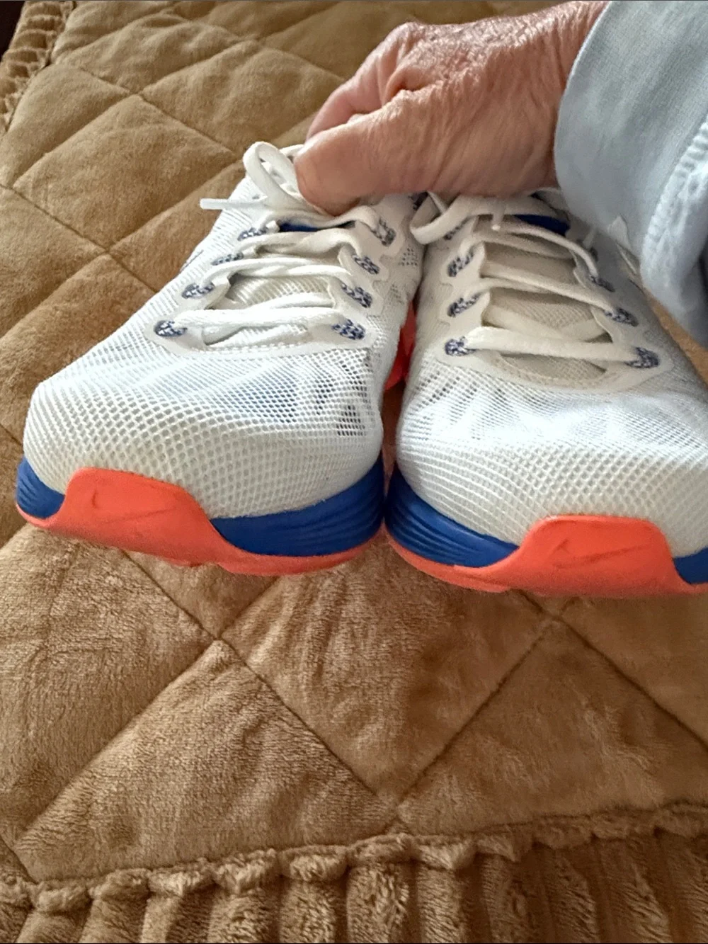 Nike Women's White Running Shoes with Blue and Pink Accents